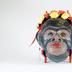 Monkey mask with flowers and earrings