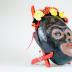 Monkey mask with flowers and earrings