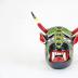 Small devil mask with green lizard