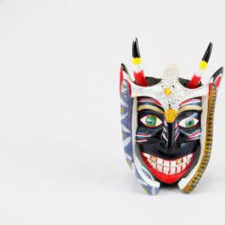 Small black devil mask with bird