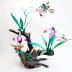 Orchid and Hummingbirds on driftwood base